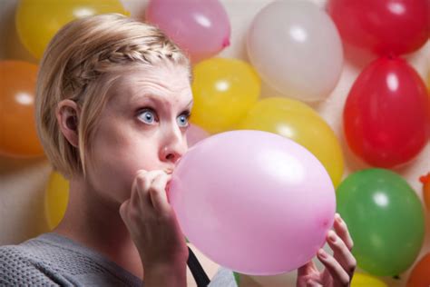 balloon blowing woman|Woman Blowing Balloon Videos and HD Footage .